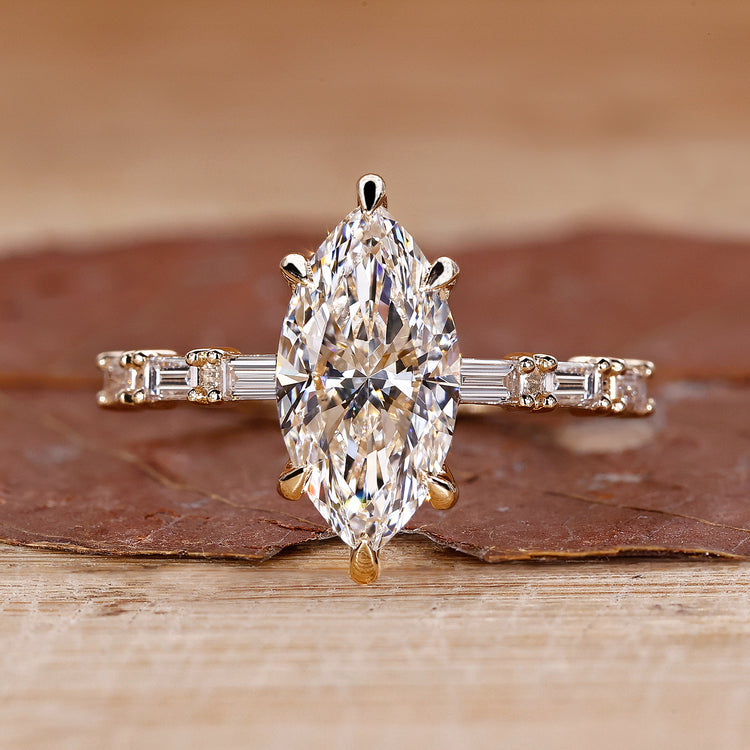 Marquise diamond engagement ring with pave setting ring.
