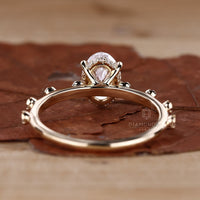 Diamondrensu handmade ring with hidden halo, oval cut diamond, and claw prongs, perfect for a timeless engagement.