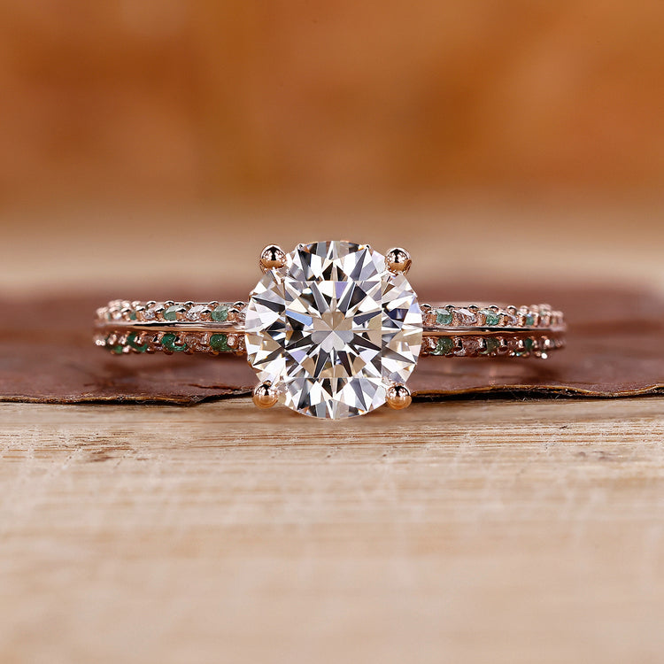 Knife edge ring with round cut diamond and pavé setting in rose gold.
