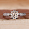 Old mine cushion cut diamond ring with pave setting ring.
