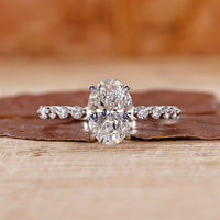 oval diamond engagement ring with floating bubble prong.
