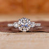 3 stone diamond ring with round cut diamonds in white gold.
