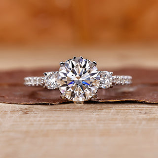 3 stone diamond ring with round cut diamonds in white gold.
