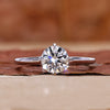 Round diamond engagement ring in white gold ring.
