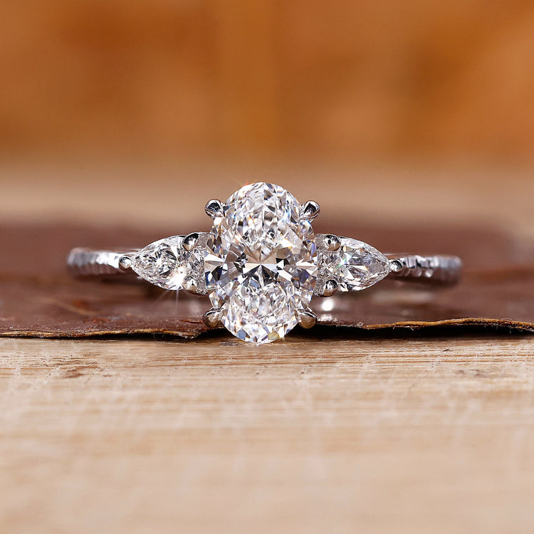 Three stone diamond ring in white gold ring.
