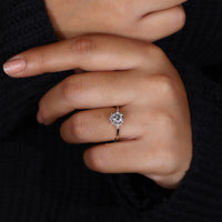 prong setting with round cut side stones.
