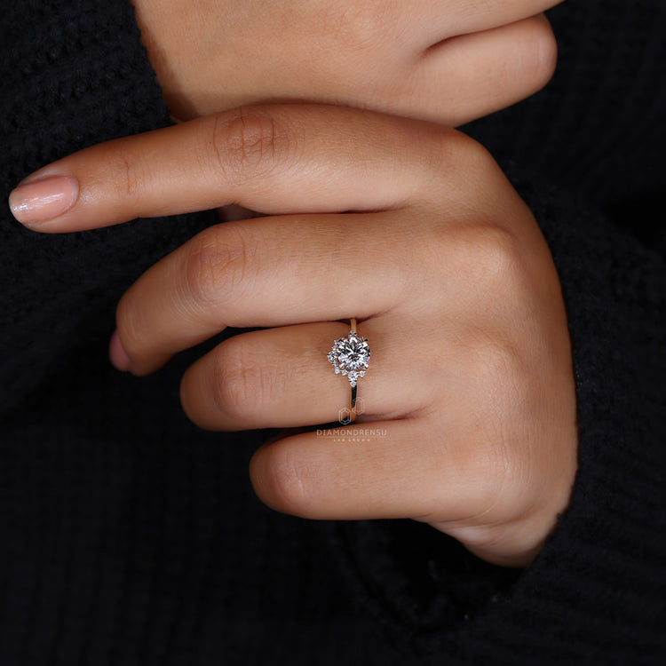prong setting with round cut side stones.
