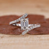 Emerald engagement ring crafted in a bypass setting with a modern twist.
