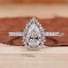 pear shaped diamond ring in pave setting style.
