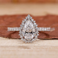 pear shaped diamond ring in pave setting style.

