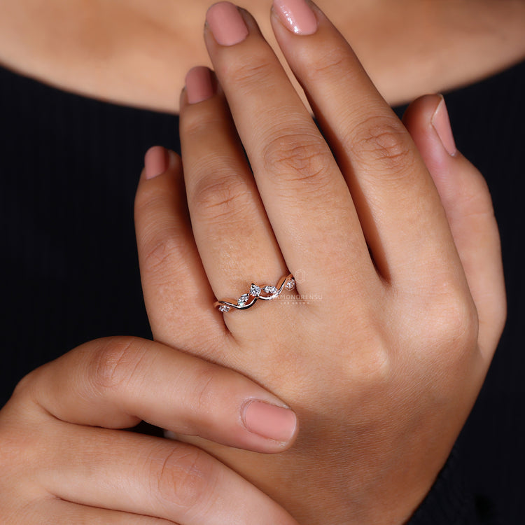 Rose gold band with prong setting.