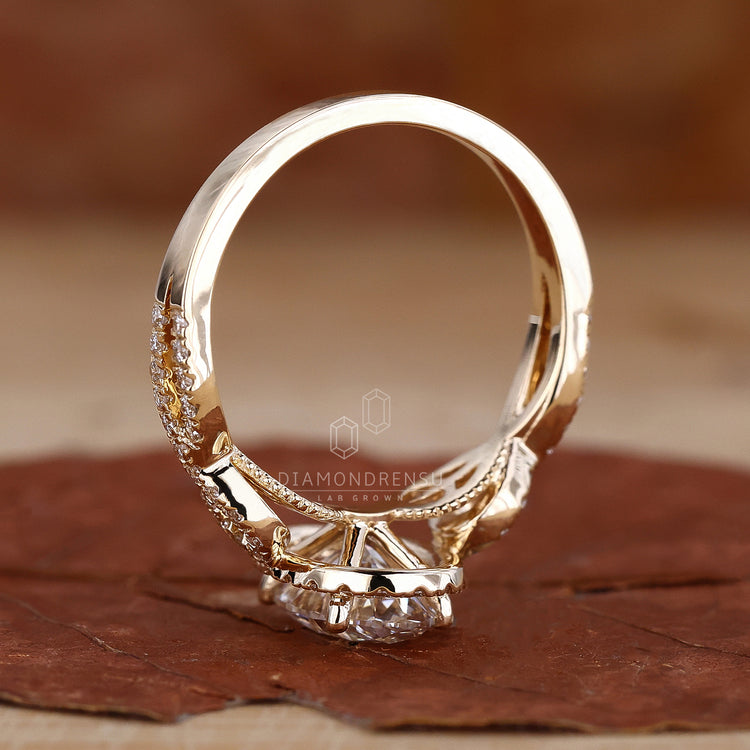 Round diamond halo setting ring in yellow gold for custom orders.
