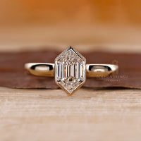 Hexagon solitaire ring with cathedral setting.
