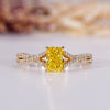 Yellow diamond engagement ring with radiant engagement ring.
