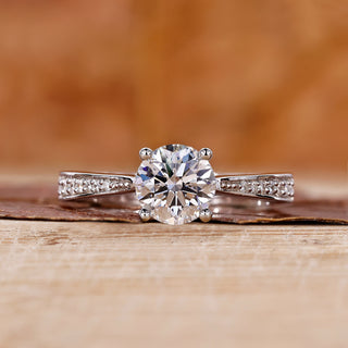 round diamond engagement ring with cathedral setting ring.
