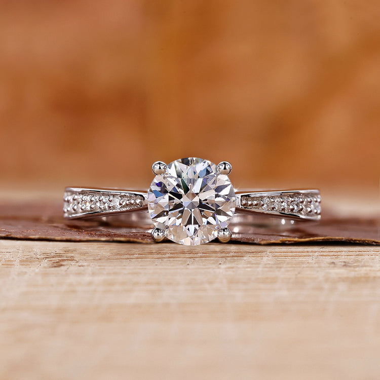 round diamond engagement ring with cathedral setting ring.
