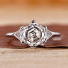 Hexagon engagement ring with triangle side stone.
