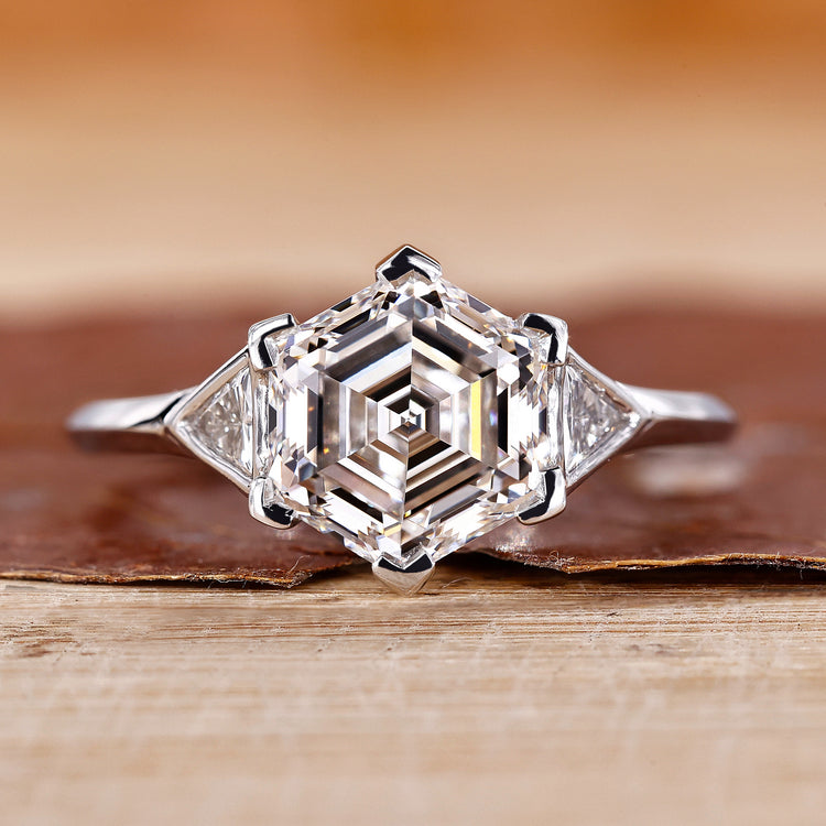 Hexagon engagement ring with triangle side stone.

