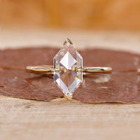 Yellow gold diamond ring with Dutch marquise cut and tapered shank.
