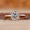 Yellow gold solitaire engagement ring with a round cut diamond centre.
