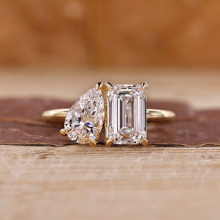 Toi et moi engagement ring with emerald and pear cut ring.
