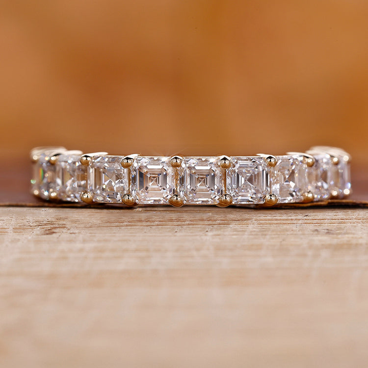 Asscher cut wedding band with yellow gold wedding band.