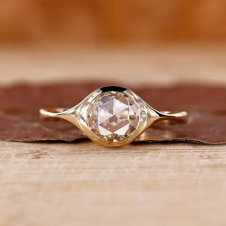 Bezel set diamond ring in yellow gold ring
