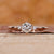Three stone engagement ring with round diamond ring.
