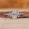 Elongated cushion cut diamond ring set in a white gold band.
