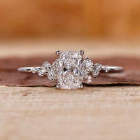 Elongated cushion cut diamond ring set in a white gold band.
