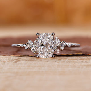 Elongated cushion cut diamond ring set in a white gold band.

