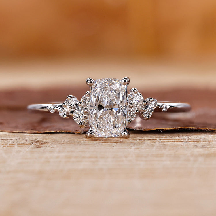 Elongated cushion cut diamond ring set in a white gold band.
