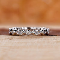 Bezel setting diamond band for stacking.