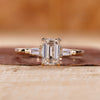Emerald cut engagement ring with Tapered Baguette side stone.
