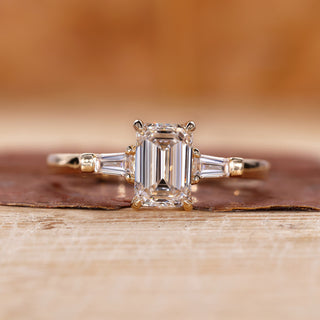 Emerald cut engagement ring with Tapered Baguette side stone.
