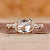 Oval rose cut diamond ring set in an east west design.
