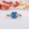 Blue diamond engagement ring with elegant sparkle.
