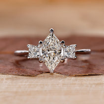 3 stone engagement ring with princess cut side stones.
