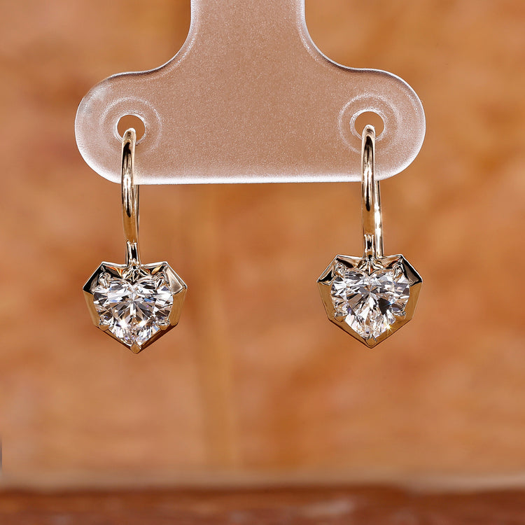 Heart diamond earrings in yellow gold for women.
