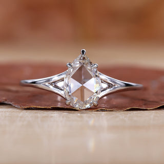 Pear rose cut engagement ring with solitaire diamond ring.
