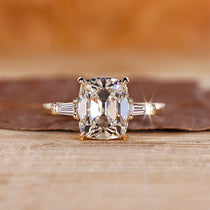 Cushion cut diamond ring with 4 claw prong.
