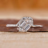 Hexagon cut engagement ring with round cut side stone.
