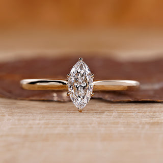 Marquise diamond engagement ring with tulip setting ring.
