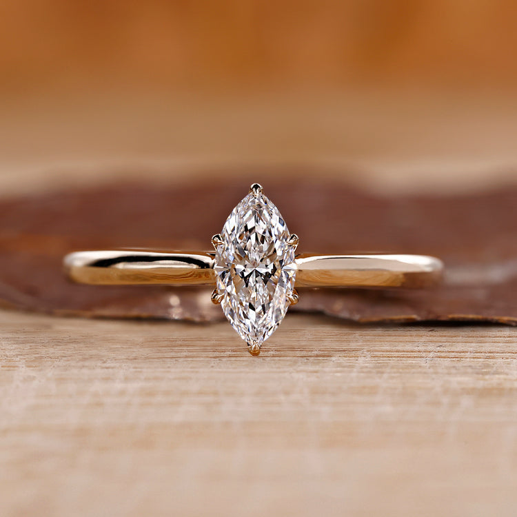 Marquise diamond engagement ring with tulip setting ring.
