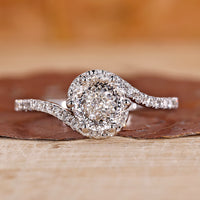 Portuguese cut diamond ring with bypass halo engagement ring.
