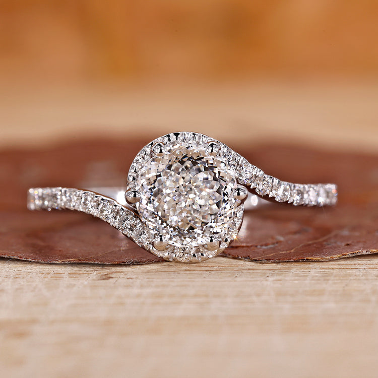 Portuguese cut diamond ring with bypass halo engagement ring.
