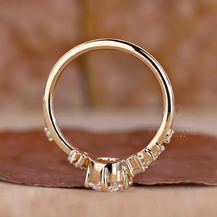 Muse setting ring with emerald cut side stones.
