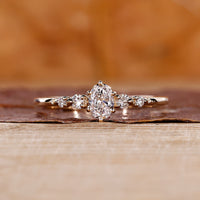Oval diamond engagement ring with 5 stone engagement ring.
