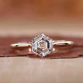 cathedral setting engagement ring in yellow gold ring.
