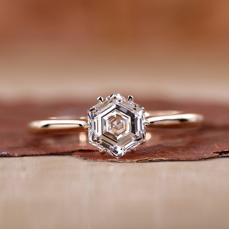 cathedral setting engagement ring in yellow gold ring.

